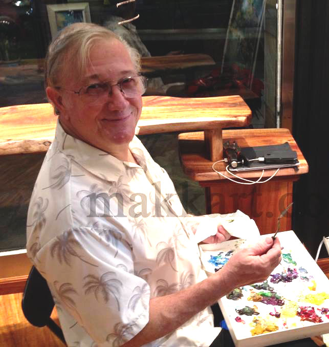 AB Makk shown with a paint pallet in his lap