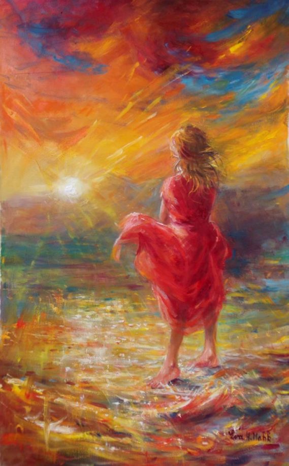 A Celebration of Life by Eva Makk shows a woman standing at the ocean shoreline gazing at the setting sun over the ocean. The colors are yellows, golds, reds and hints of blue in the water.